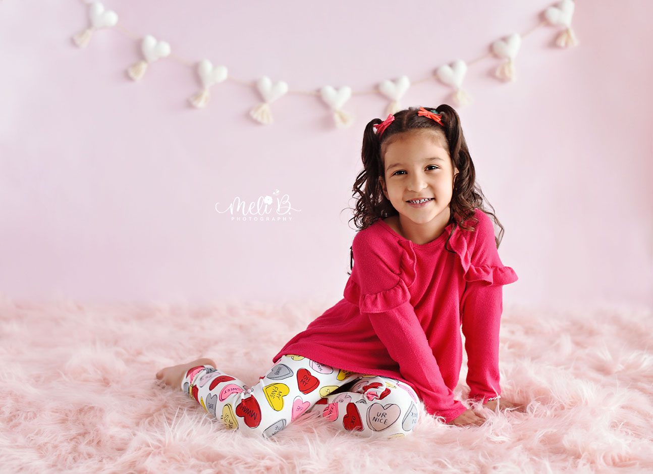 A child smiling during a photo session